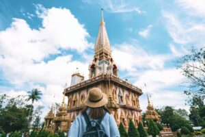 Visitor walking toward Wat Chalong temple in Phuket