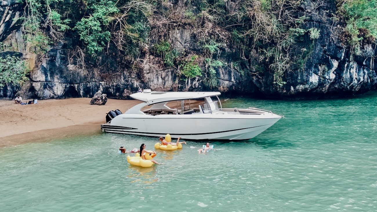 Catamaran anchored beside a tropical beach on a private charter