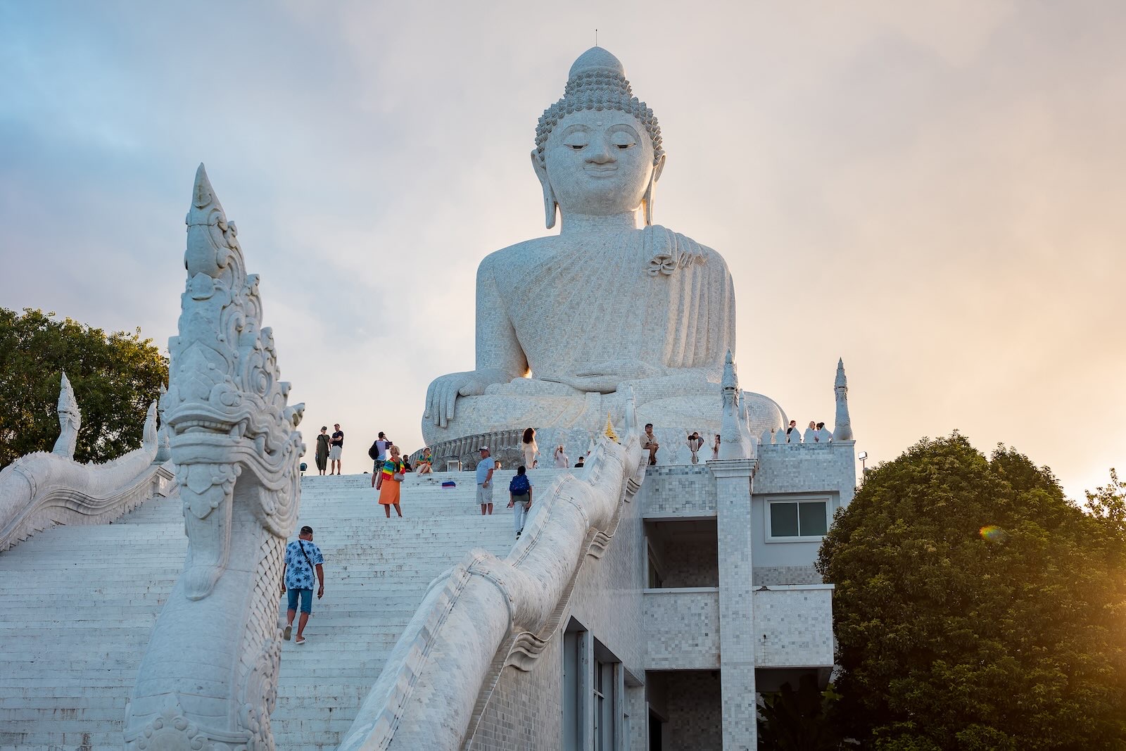 Large white marble Big Buddha statue seen from the main viewing area in Phuket